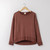 Flat lay of organic cotton classic fleece crew in color masala.