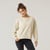 Front view of model wearing reversible fleece crew in pearl.