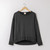 Flat lay of organic cotton classic fleece crew in color pepper.