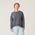 Front view of model wearing reversible fleece crew in infinity blue.