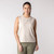 Front view of model wearing organic cotton sleeveless tee in pearl.