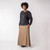 Full body front view of model wearing organic cotton maxi skirt in turmeric.