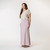 Full body side view of model wearing organic cotton maxi skirt in lavender.
