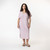 Front full body view of model wearing organic cotton kaftan dress in lavender.
