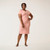 Front full body view of model wearing organic cotton kaftan dress in blush.