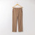 Flat lay of organic cotton flare pant in turmeric.