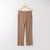 Flat lay of organic cotton flare pant in turmeric.
