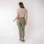 Back full body view of model wearing organic cotton cropped flare pant in bay.