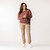Front full body view of model wearing organic cotton cropped flare pant in turmeric.