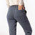 Close up back view with model hand in back pocket in organic cotton classic sweat pant in infinity blue.