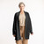 Front view of model wearing organic cotton cardigan sweater in color pepper
