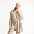 Front view of model wearing organic cotton cardigan sweater in color pearl