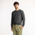 Front view of model wearing organic cotton classic crew sweater in color pepper