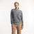 Front view of model wearing organic cotton classic crew sweater in color heather grey stripe