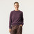 Front view of model wearing organic cotton classic crew sweater in color plum.