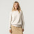 Front view of model wearing organic cotton classic crew sweater in color pearl.