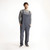 Full body front view of model wearing organic cotton overalls in color infinity blue.