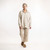 Full body front view of model wearing organic cotton workwear shirt in color pearl.