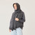 Close up side view of model wearing organic cotton oversized pocket scarf in infinity blue.
