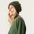 Close up of model wearing organic cotton chunky beanie in color pine stripe