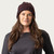 Close up of model wearing organic cotton chunky beanie in color plum stripe