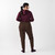 Full body back view of model wearing organic cotton fleece jogger in color chocolate