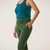 Close up side view of model wearing organic cotton fleece jogger in pine.