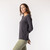 Side view of model wearing organic cotton layering tee in color pepper