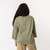 Close up back view of model wearing organic cotton 3/4 sleeve tee in color bay.