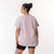Close up back view of model wearing organic cotton French tuck tee in color lavender.