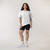 Full body front view of model wearing organic cotton French tuck tee in color salt.