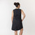 Back view of model wearing organic cotton hi low dress in color pepper.