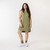 Full body front view of model wearing organic cotton hi low dress in color bay.