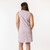 Close up back view of model wearing organic cotton hi low dress in color lavender.