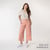 Full body view of model wearing organic cotton gaucho pant in color blush.