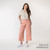 Full body view of model wearing organic cotton gaucho pant in color blush.