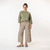 Full body view of model wearing organic cotton gaucho pant in color putty.