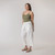 Full body side view of model wearing organic cotton harem pant in color salt.