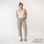 Full body front view of model wearing organic cotton harem pant in color putty.