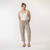 Full body front view of model wearing organic cotton harem pant in color putty.
