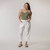 Full body front view of model wearing organic cotton harem pant in color salt.