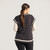 Back view of model wearing 100% Regenerative Organic Certified® Cotton sweater vest in color pepper.