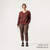 Full body front view of model wearing 100% Regenerative Organic Certified® Cotton  V-Neck Sweater in color masala stripe.