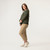 Full body side view of model wearing 100% Regenerative Organic Certified® Cotton  V-Neck Sweater in color pine stripe.