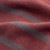 Close up photo of 100% regenerative organic certified cotton v neck sweater fabric.