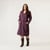 Full body front view of model wearing organic cotton workwear dress in color plum.