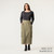 Front view of model wearing 100% organic cotton surplus skirt in color bay.