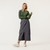 Front view of model wearing 100% organic cotton surplus skirt in color infinity blue.
