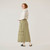 Side view of model wearing 100% organic cotton surplus skirt in color bay.