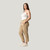 Full body side view of model wearing 100% organic cotton surplus pant in color khaki.